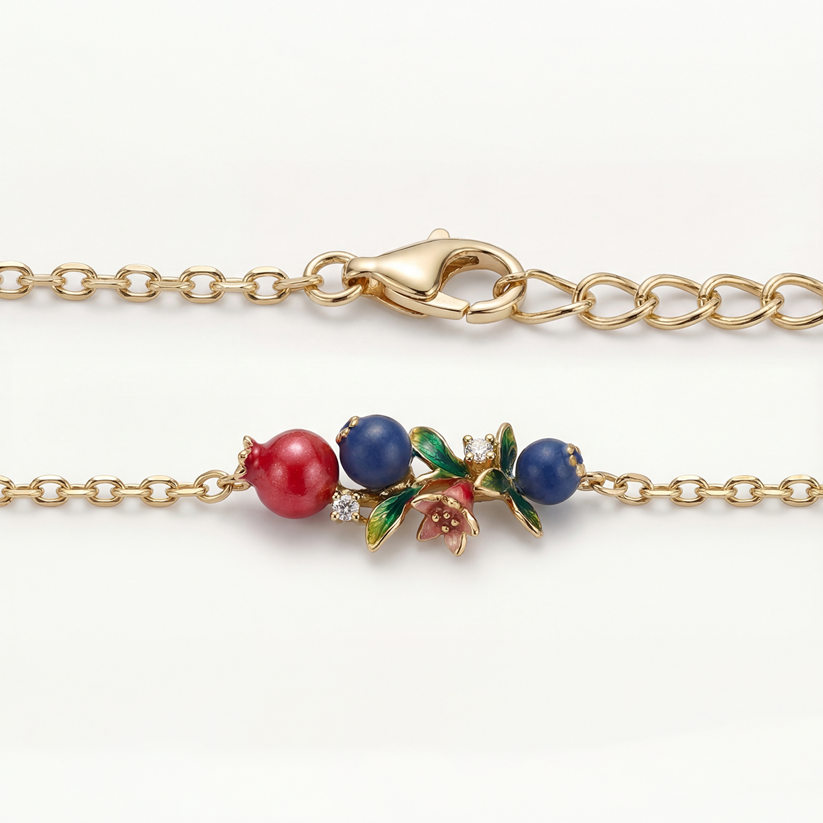 Gold bracelet with colorful beads on a white background