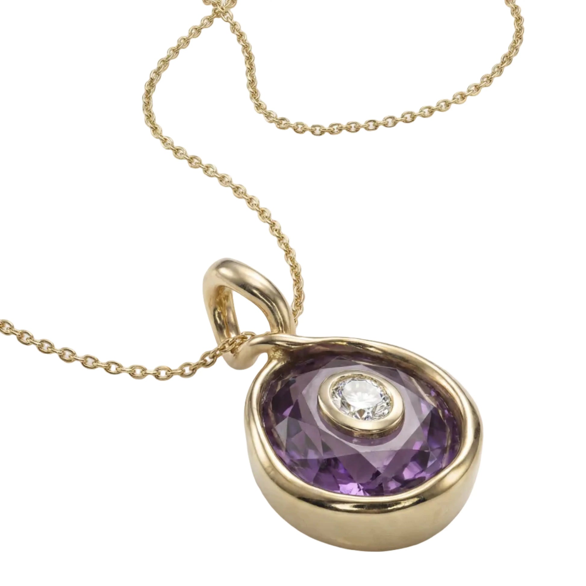 Gold pendant with purple gemstone and diamond on a white background